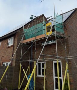 Access scaffold for fascia work at rear of two storey property in Godalming