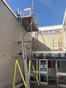Commercial access scaffold at Vent-Axia in Crawley with ladder access and working platform