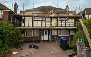 Chimney table lift with a ladder and ladder gate above the side scaffold platform of a house in Bernard Road, Worthing